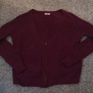 Maroon sweater with gold zipper